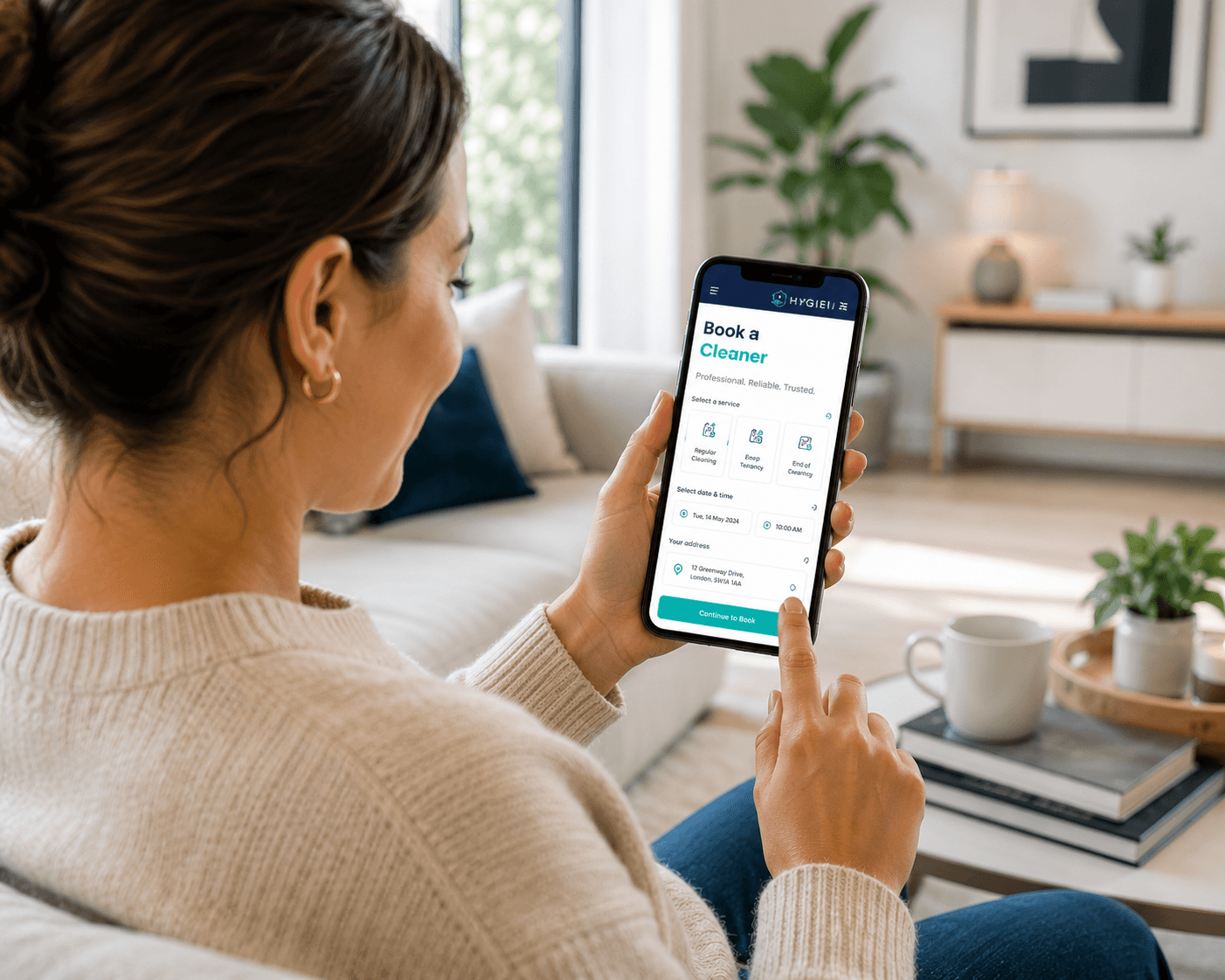 A customer booking a cleaner on the Hygeia app from her phone